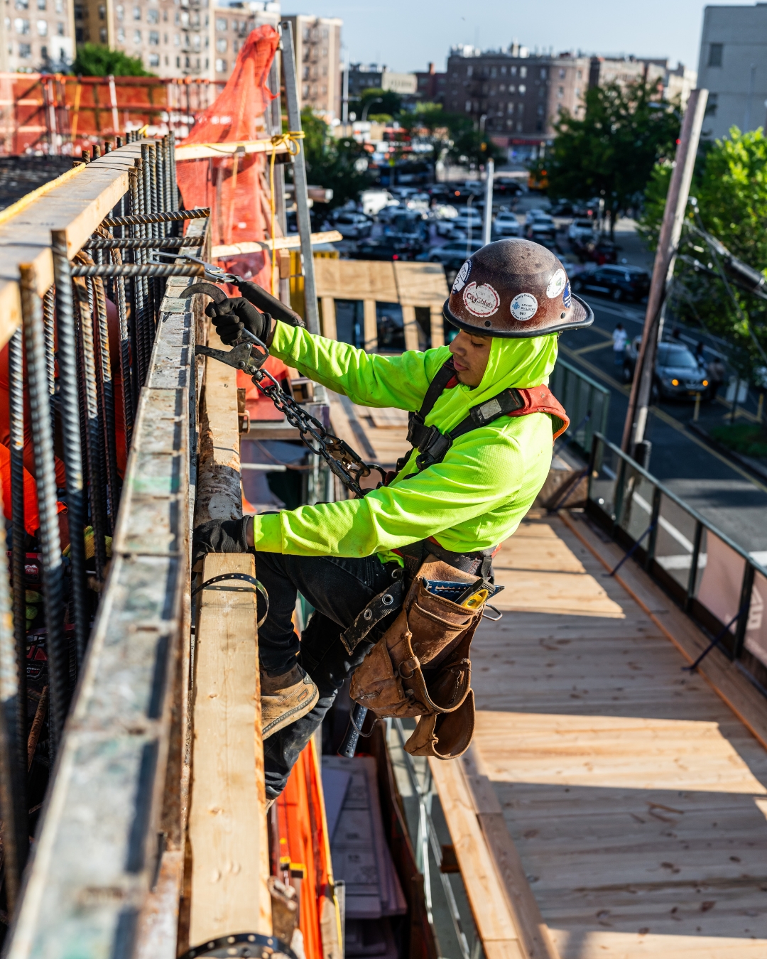 Ironworker on building edge overlooking NYC